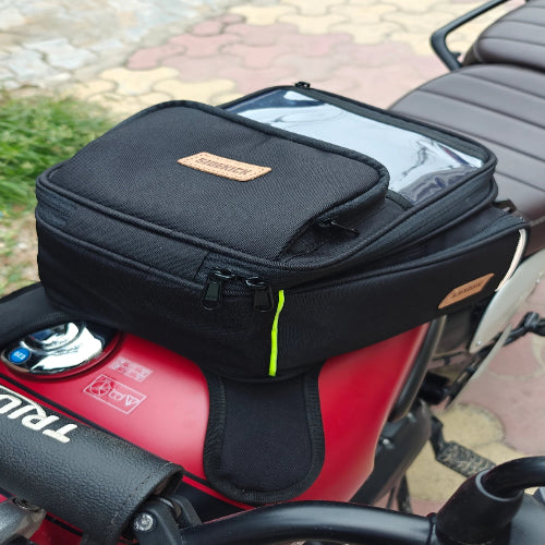 Black motorcycle bag attached to a red motorcycle