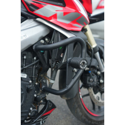 Close-up of a motorcycle with a black protective guard on a blurred background